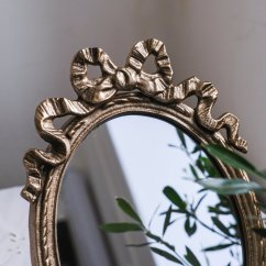 Oválné zdobené zrcadlo 32x21 cm