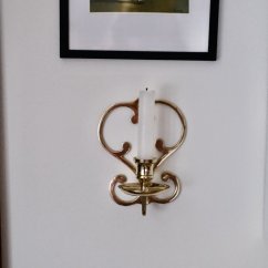 Mosazný závěsný svícen na zeď